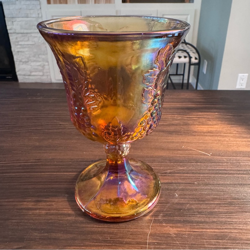 Indiana Carnival Glass Marigold Goblet with a harvest grape pattern